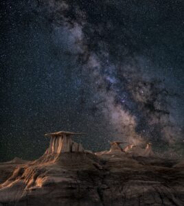 Image of some ruins with the Universe in the back ground.